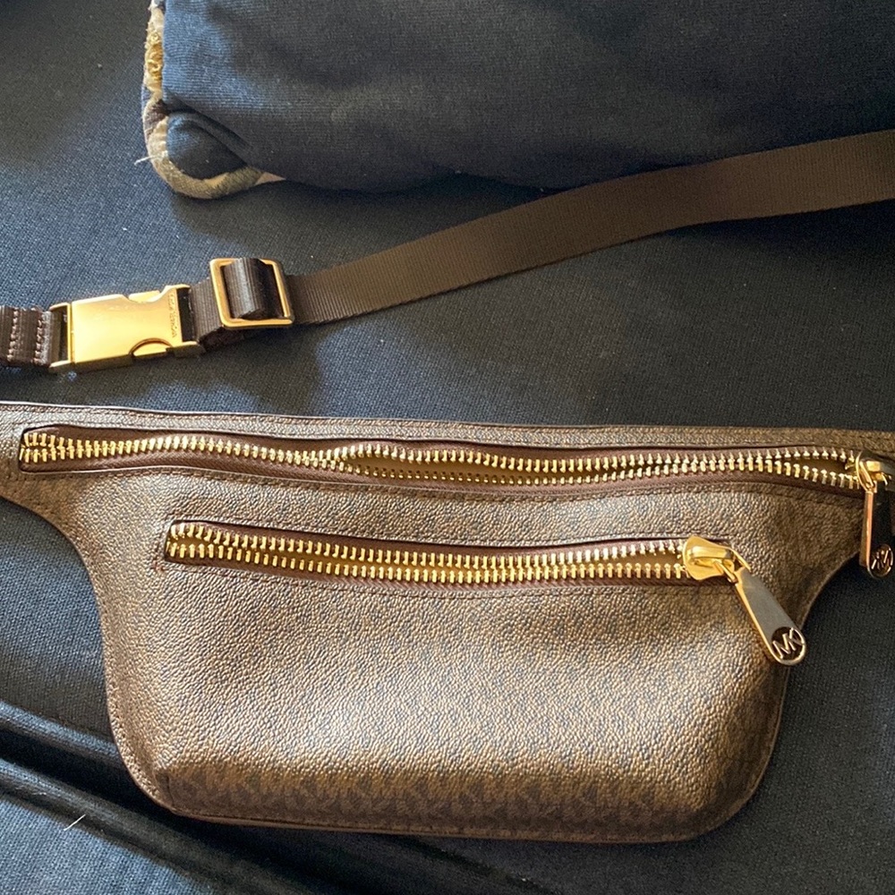 Michael Kors' belt bag in a contemporary logo-print design.
